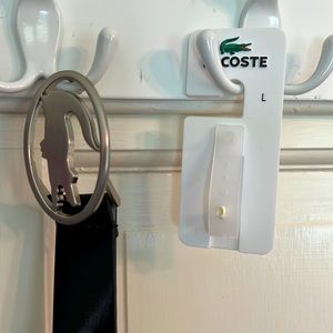 Lacoste black patent leather belt with brushed nickel buckle. Never worn.